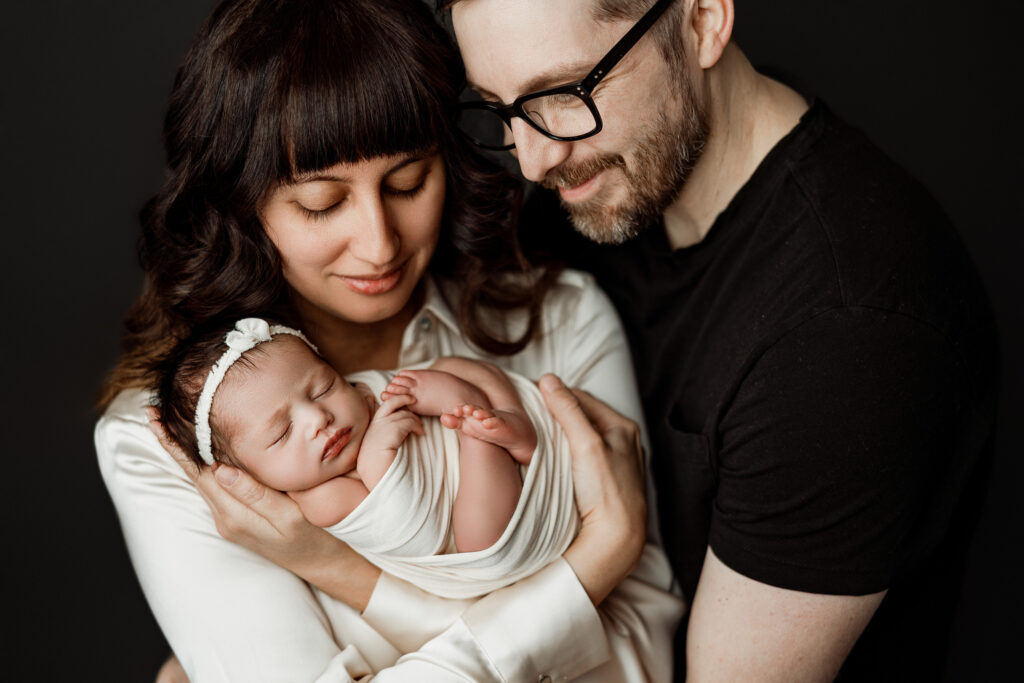 Emotional newborn family portraits near Traverse City