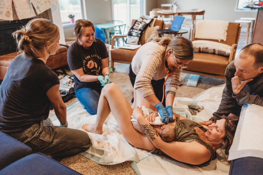 Peaceful home birth moment captured by Arielle Elizabeth Photography in Northern Michigan.
