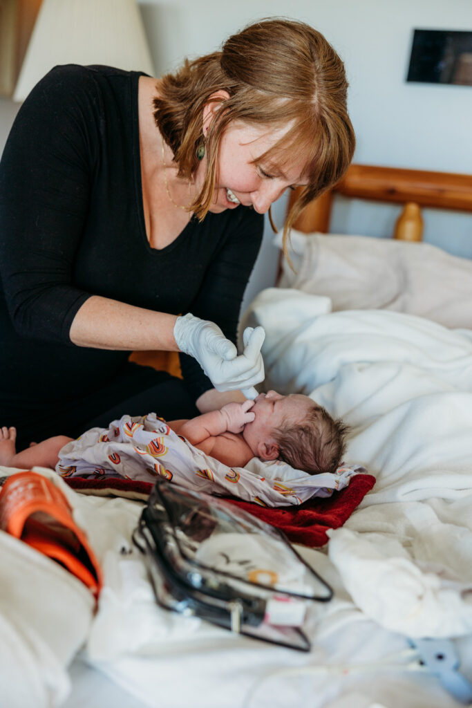 Labor nurse and birth photographer documenting intimate home birth experience.