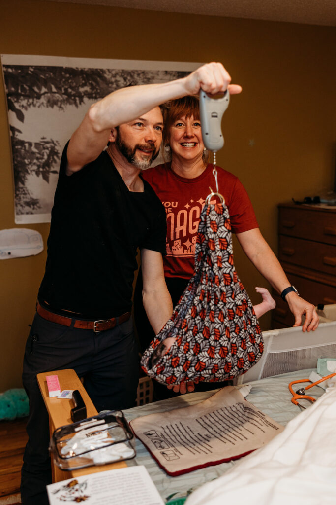 Beautiful newborn moments after delivery at home, photographed in Northern Michigan.